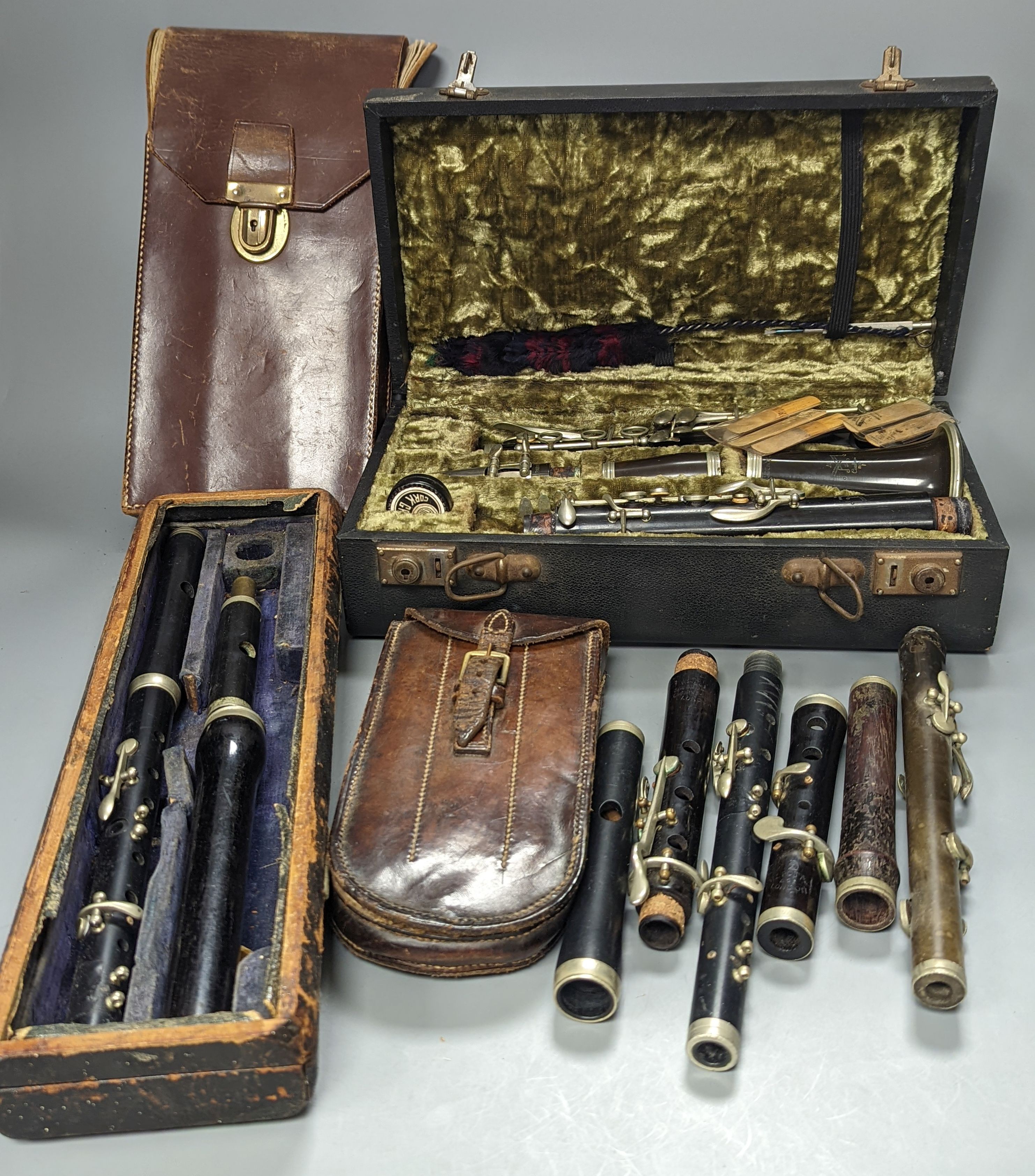 Three ebony or rosewood flutes and a clarinet